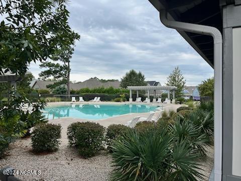 view of pool featuring a patio