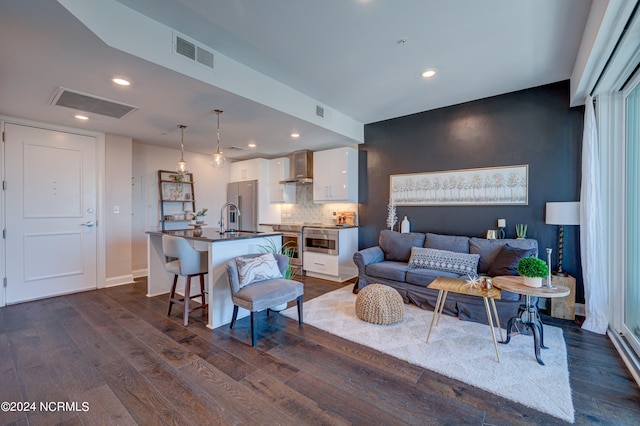 living room featuring dark wood-type flooring