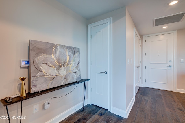 hall with dark wood-type flooring