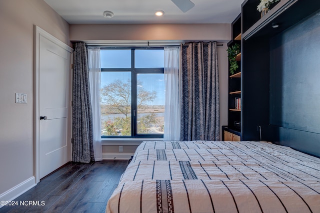 unfurnished bedroom with dark hardwood / wood-style flooring