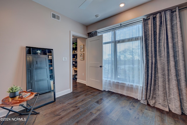 empty room featuring dark hardwood / wood-style flooring