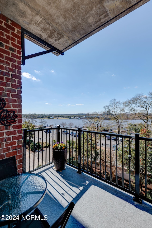 balcony featuring a water view