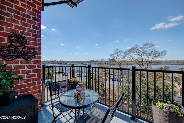 balcony featuring a water view