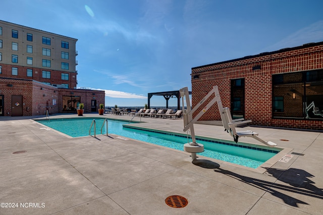 view of swimming pool featuring a patio area