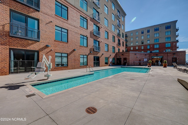 view of swimming pool featuring a patio area