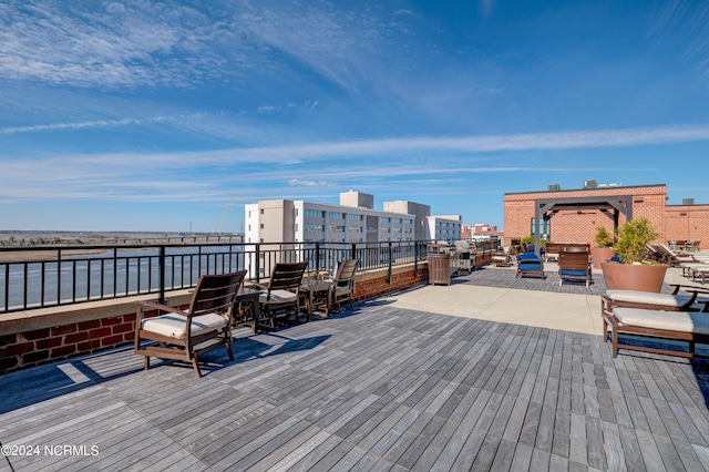 wooden deck with a water view