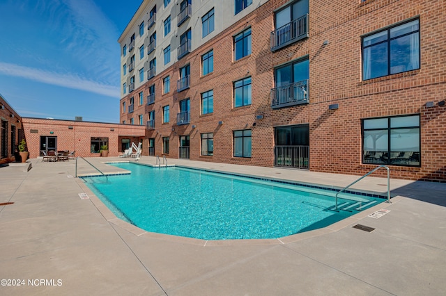 view of pool featuring a patio