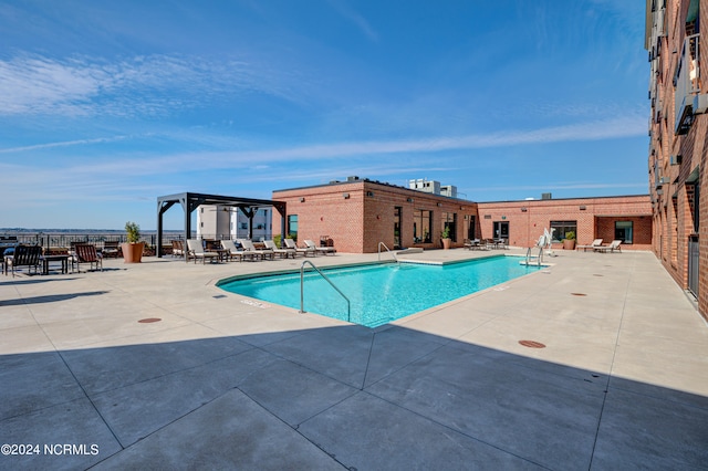 view of swimming pool featuring a patio area