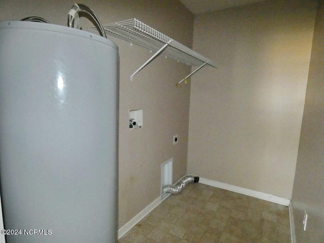 washroom featuring baseboards, water heater, laundry area, hookup for a washing machine, and electric dryer hookup