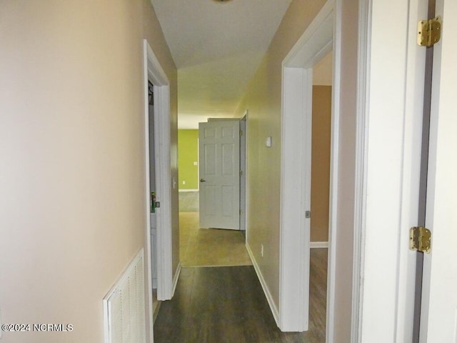 hallway featuring dark wood-type flooring