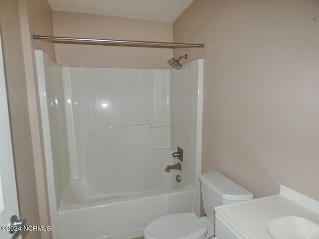 bathroom featuring vanity, toilet, and shower / bathtub combination