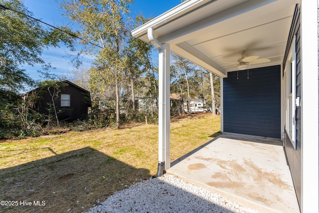 view of yard featuring ceiling fan