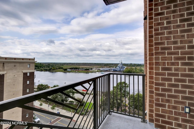 balcony featuring a water view
