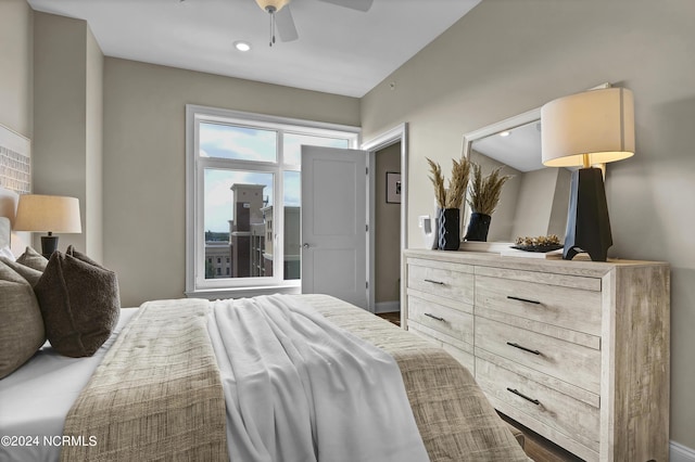 bedroom featuring baseboards and ceiling fan