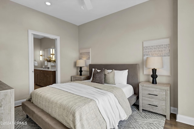 bedroom with connected bathroom, baseboards, recessed lighting, and dark wood-style flooring