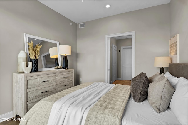bedroom featuring baseboards, visible vents, and recessed lighting