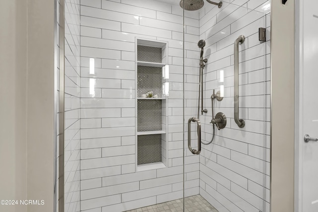 bathroom with a shower stall