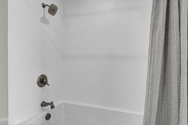 interior details with shower / tub combo