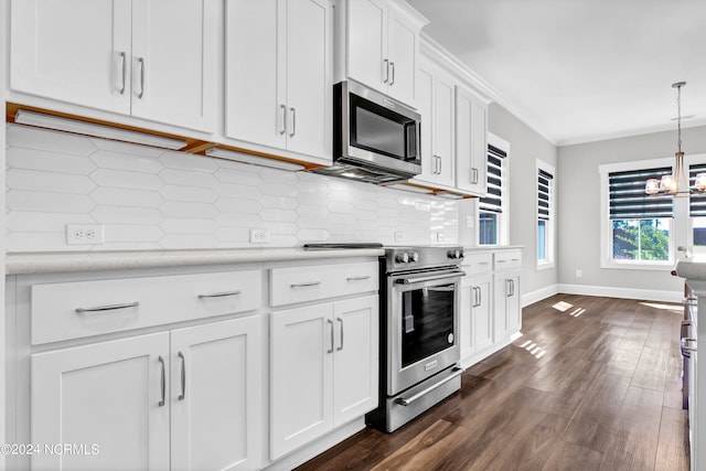 kitchen featuring white cabinets, backsplash, stainless steel appliances, a notable chandelier, and dark hardwood / wood-style flooring