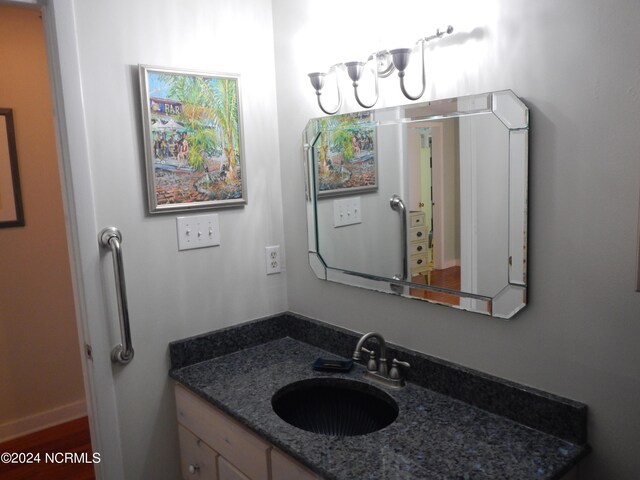 bathroom with vanity, toilet, and a shower with shower door