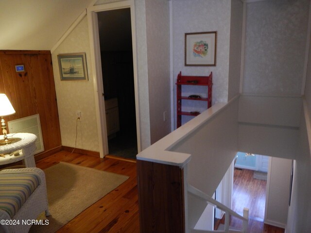 stairs featuring hardwood / wood-style flooring