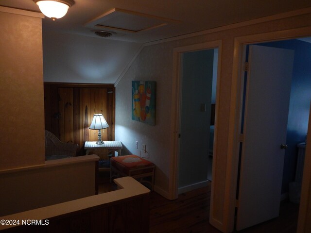 interior space with lofted ceiling and hardwood / wood-style floors