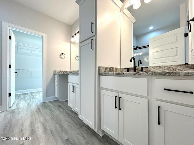 bathroom featuring vanity and hardwood / wood-style flooring