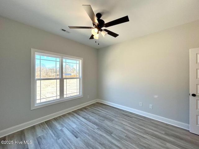 empty room featuring ceiling fan and wood-type flooring