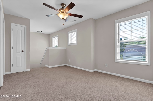 carpeted empty room with ceiling fan