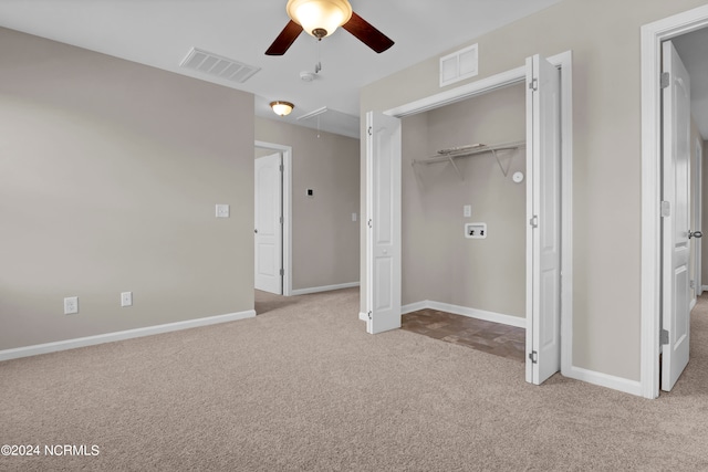 unfurnished bedroom with light carpet, ceiling fan, and a closet