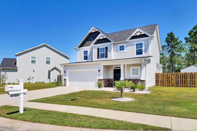 craftsman inspired home featuring a front lawn and a garage