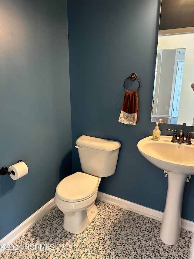 bathroom with sink and toilet