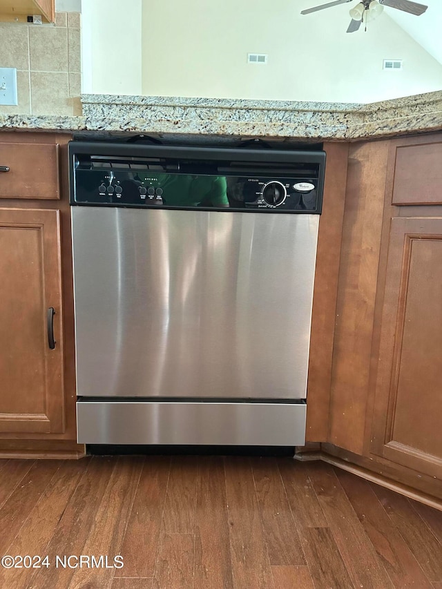 details with stainless steel dishwasher, dark hardwood / wood-style floors, ceiling fan, and light stone counters