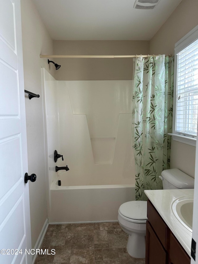 full bathroom featuring vanity, shower / bathtub combination with curtain, and toilet