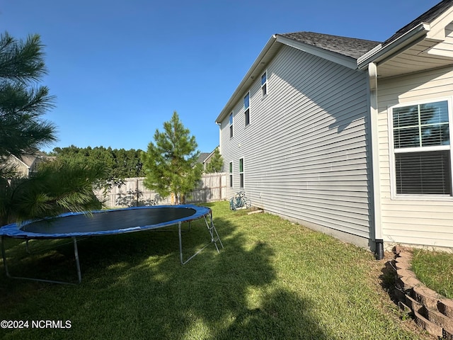 view of yard with a trampoline