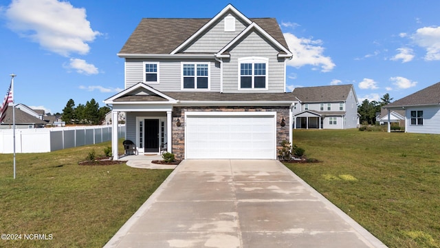 view of front facade with a garage and a front yard