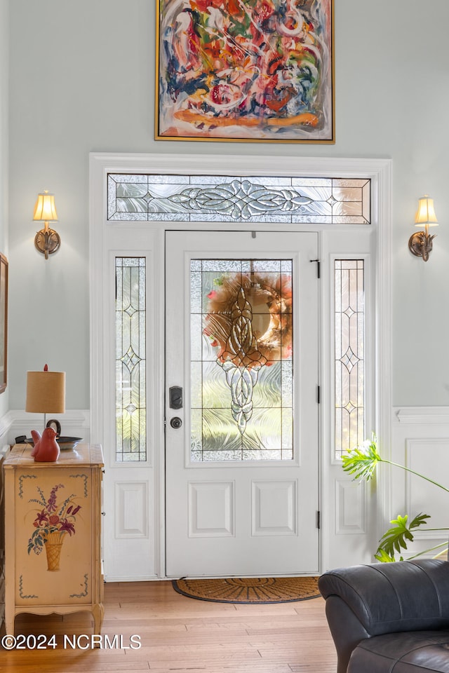 foyer entrance featuring light wood-type flooring and plenty of natural light