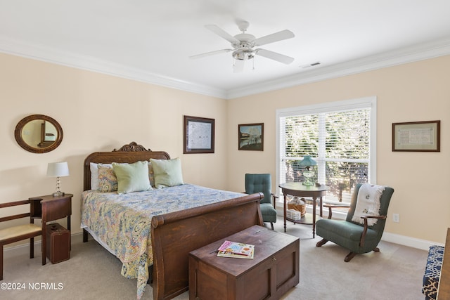 carpeted bedroom with crown molding and ceiling fan