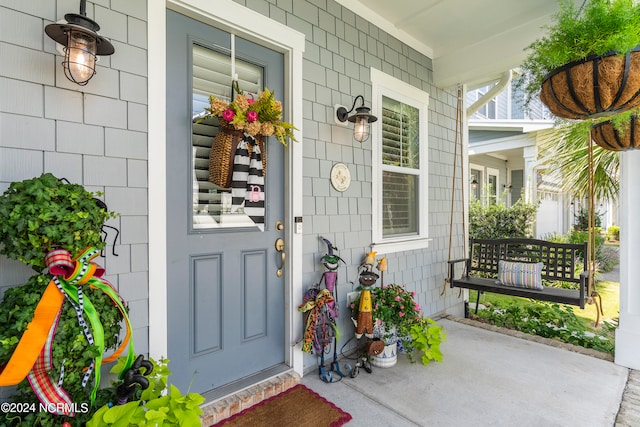 entrance to property with a porch