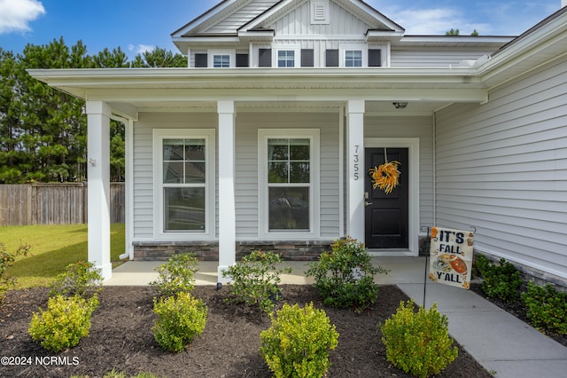 doorway to property with a porch