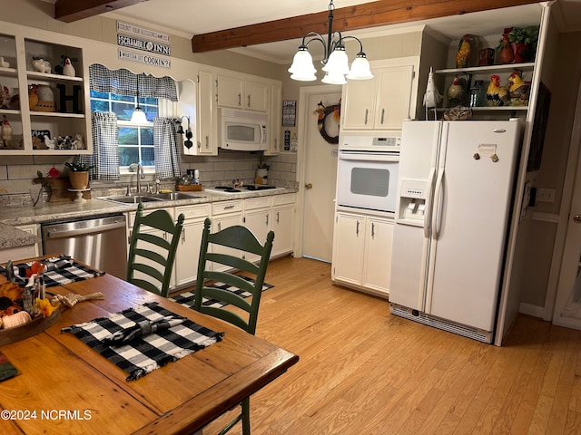 kitchen featuring beamed ceiling, decorative light fixtures, white appliances, and white cabinetry