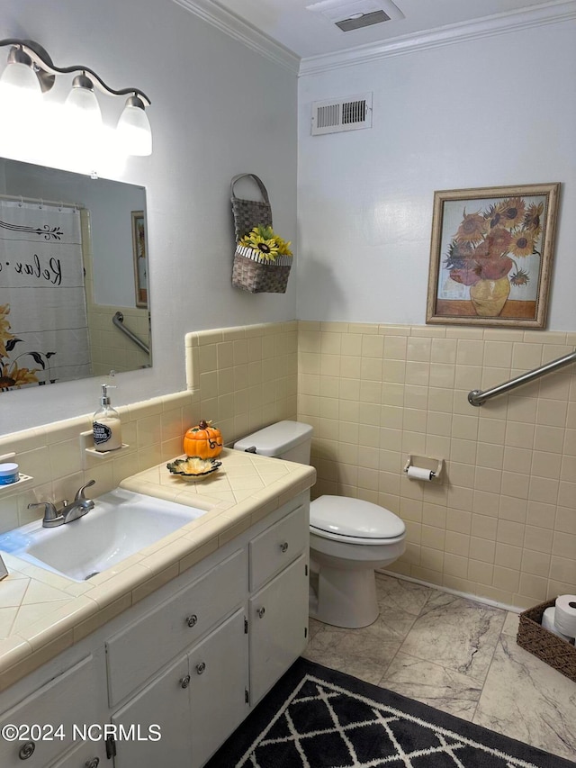 bathroom featuring ornamental molding, vanity, tile walls, and toilet