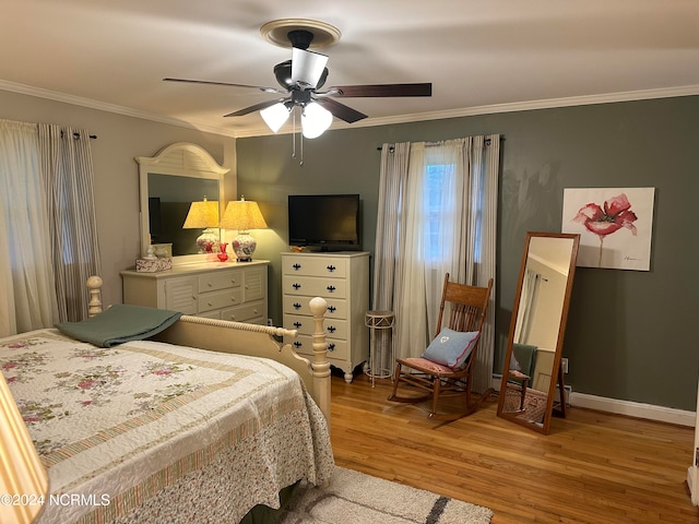 bedroom featuring crown molding, ceiling fan, and light hardwood / wood-style flooring