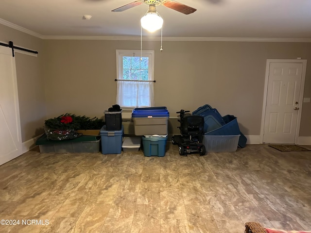 miscellaneous room with a barn door, crown molding, and ceiling fan