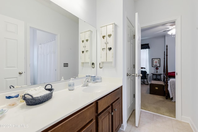 full bathroom featuring baseboards, vanity, and tile patterned floors