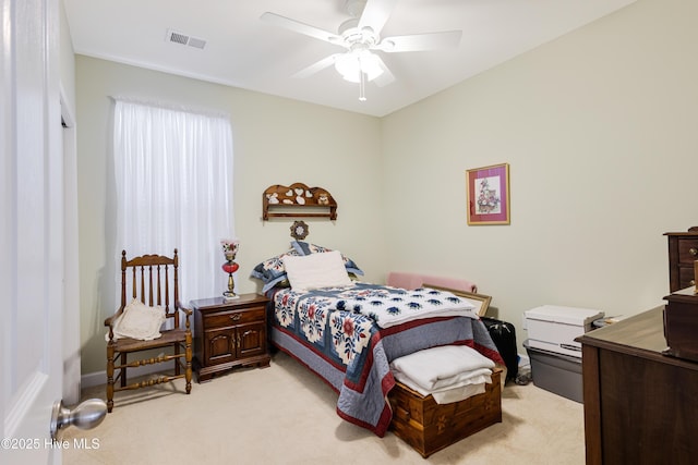 bedroom with ceiling fan and light colored carpet