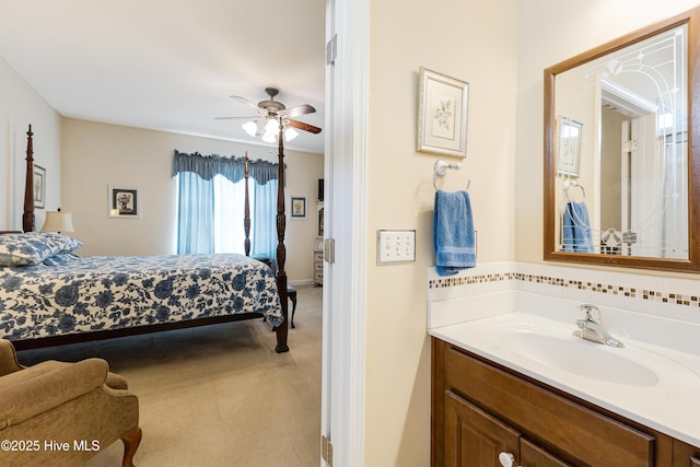 bedroom with light colored carpet and a sink