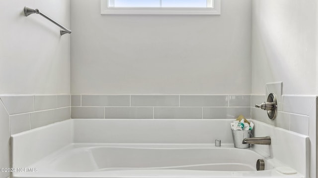 bathroom featuring a washtub