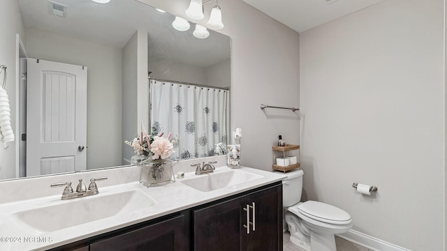 bathroom with vanity and toilet