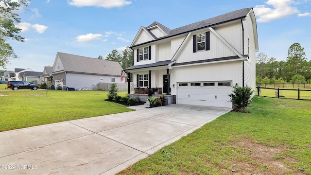 view of front of house with a front yard and a garage